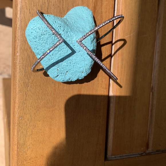 A beautiful silver bracelet with crystals on the outside of the bracelet. - Picture 4 of 8